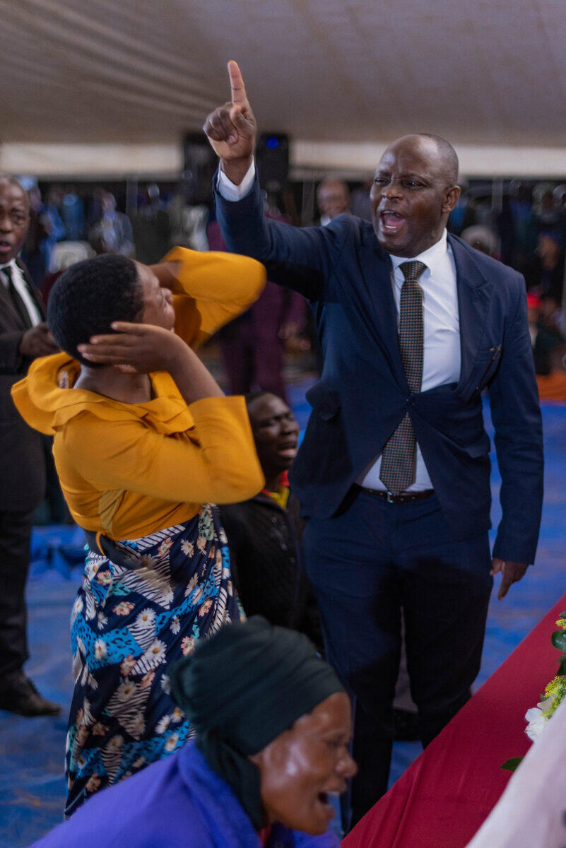 Minister pointing heavenward