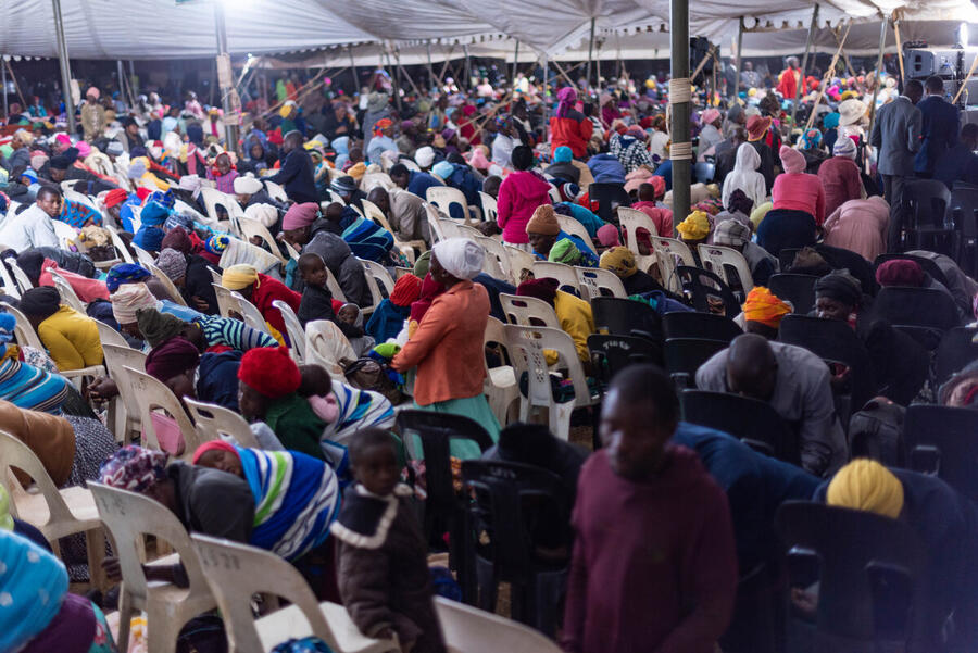 Packed congregation under the tent