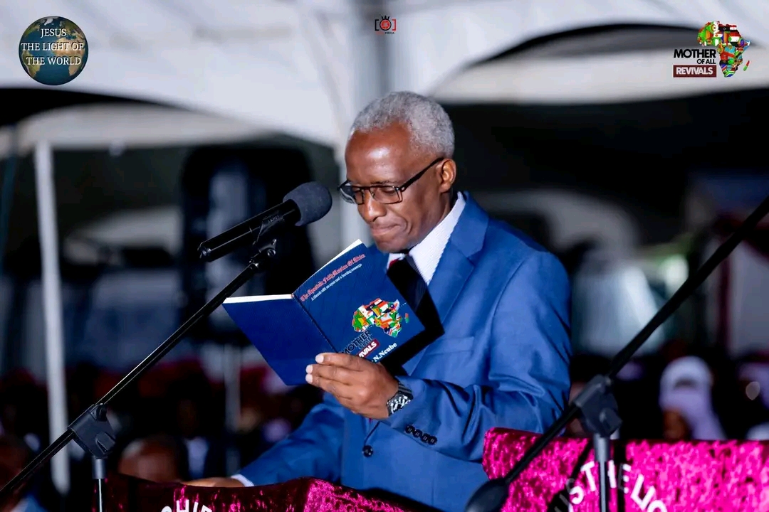 Mother Of All Revivals — minister reading the Word at the podium